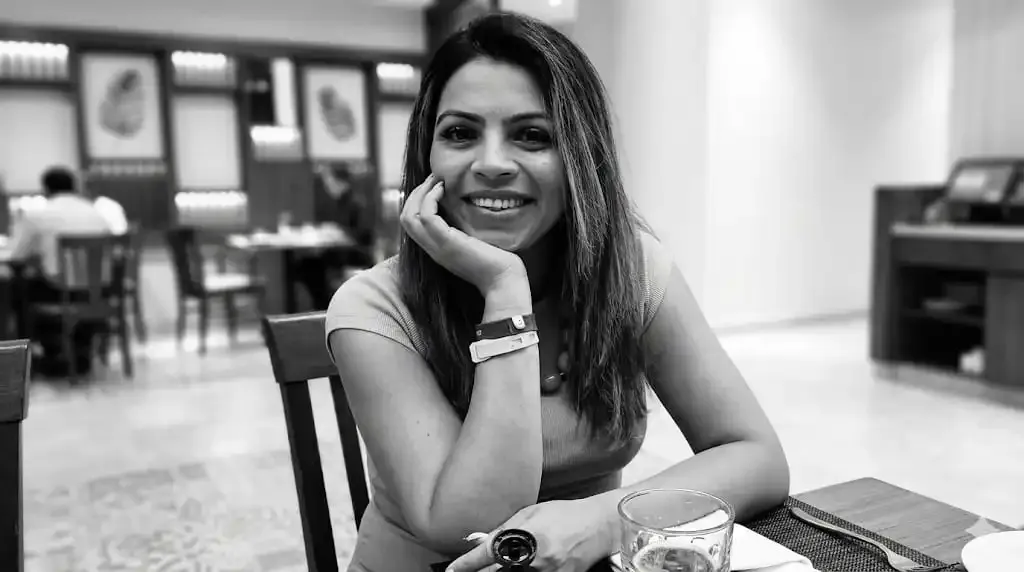 A person sitting at a desk in front of a computer